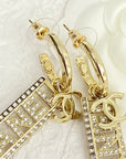 CC TEXT DIAMOND PAVED LIGHT GOLD DROP EARRINGS