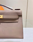 HM KELLY POCHETTE 22CM GRIS ASPHALT SWIFT GOLD HARDWARE