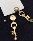 KEY SHAPED DANGLE GG EARRING