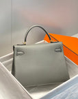 HM KELLY 25CM GRAY TOGO GOLD HARDWARE